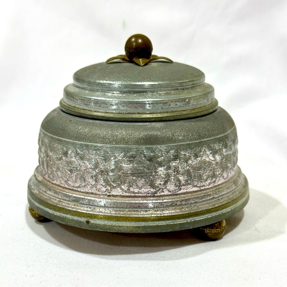 Antique aluminum musical lidded powder box